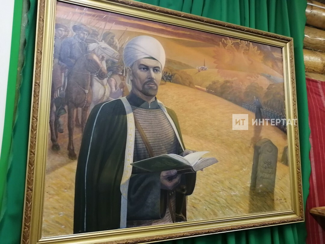 Картина: Батырша с книгой в руках на фоне сельского пейзажа